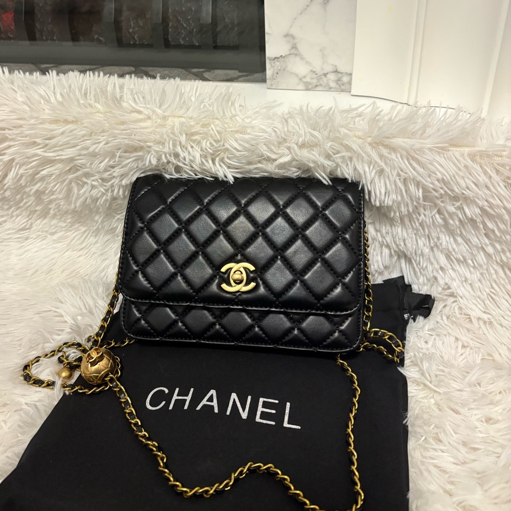 CHANEL pearl flapbag Black Quilted Crossbody Bag with Gold Accents